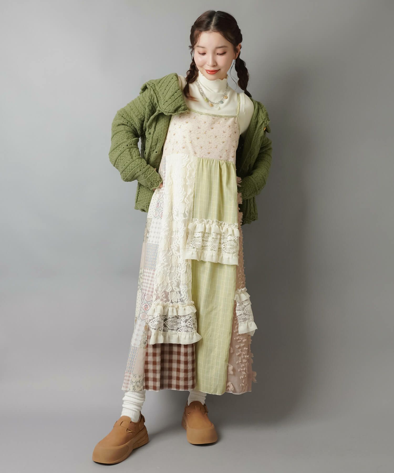 SPINNS Neo Mori Girl outfit with green chunky cardigan over a patchwork maxi dress made from floral, checked and lace panels