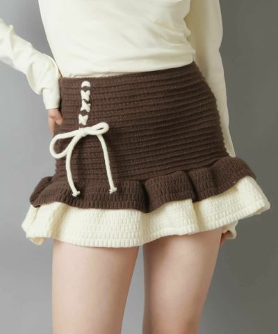 リボン付き黒トップスとピンクミニスカート リボン付き黒トップスとピンクミニスカート - メルカリ